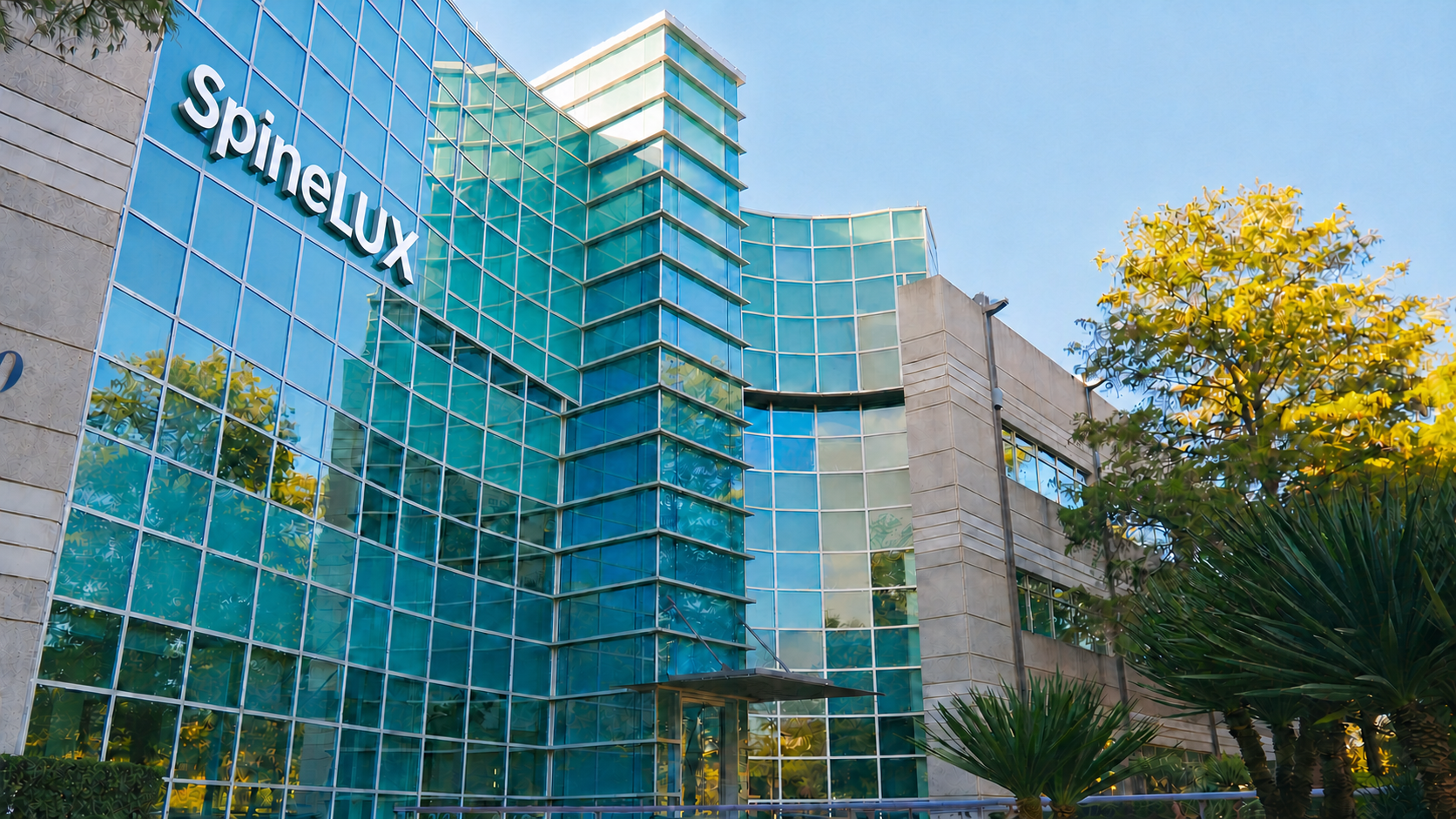 SpineLUX Irving office with white exterior SpineLUX building sign
